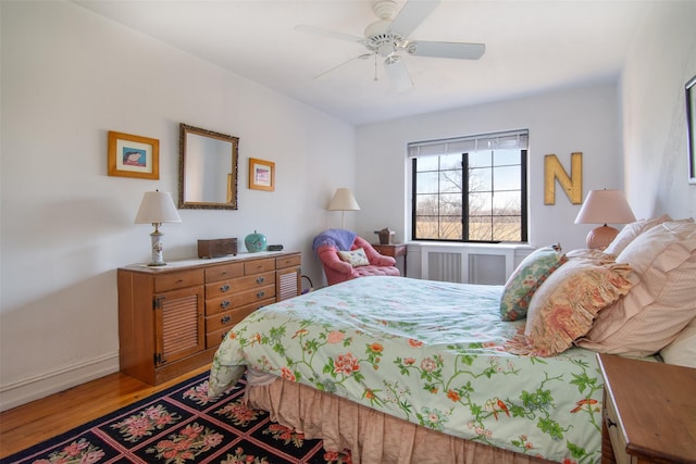 bedroom featuring wood-type flooring and ceiling fan