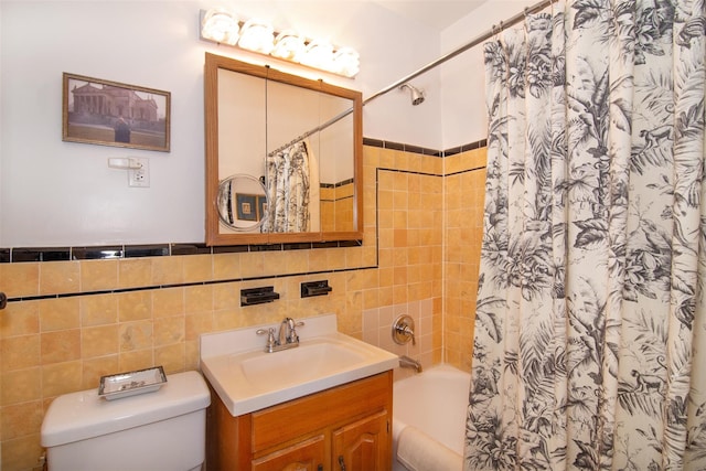 full bathroom with tile walls, vanity, toilet, and shower / bathtub combination with curtain