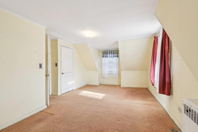 carpeted spare room featuring ornamental molding and radiator