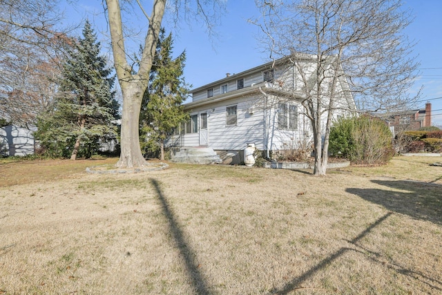 view of property exterior with a lawn