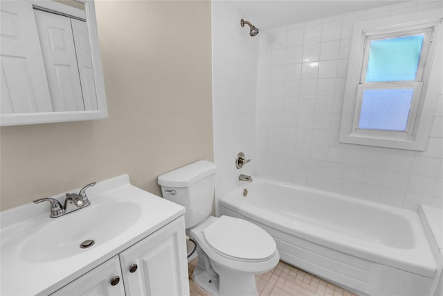 full bathroom with tiled shower / bath combo, vanity, tile patterned floors, and toilet