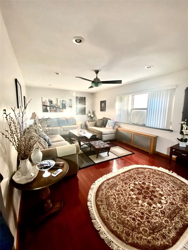 living room with ceiling fan and hardwood / wood-style floors