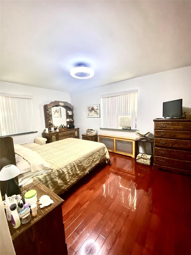 bedroom featuring dark hardwood / wood-style flooring