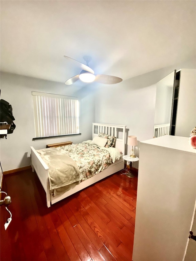 bedroom featuring wood-type flooring and ceiling fan