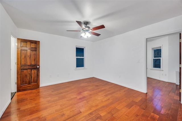 unfurnished room featuring hardwood / wood-style flooring and ceiling fan