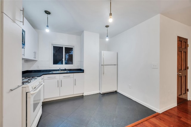 kitchen with sink, white appliances, hanging light fixtures, backsplash, and white cabinets