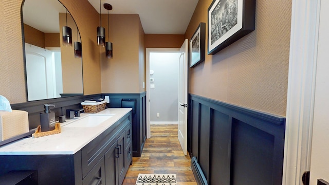 bathroom with vanity and hardwood / wood-style floors