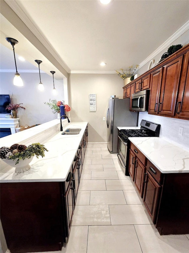 kitchen featuring sink, crown molding, decorative light fixtures, light tile patterned floors, and appliances with stainless steel finishes