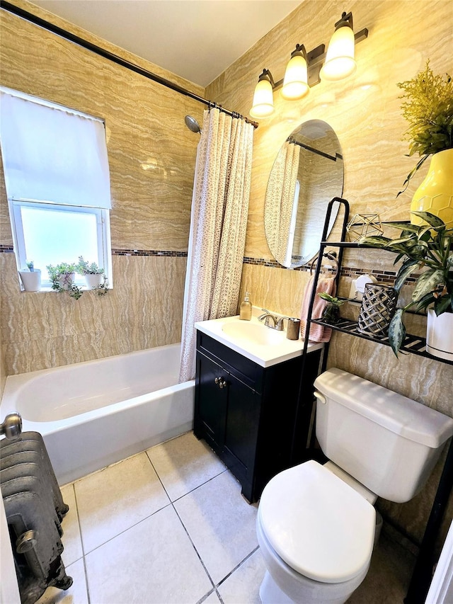 full bathroom featuring shower / tub combo, vanity, toilet, and tile patterned flooring