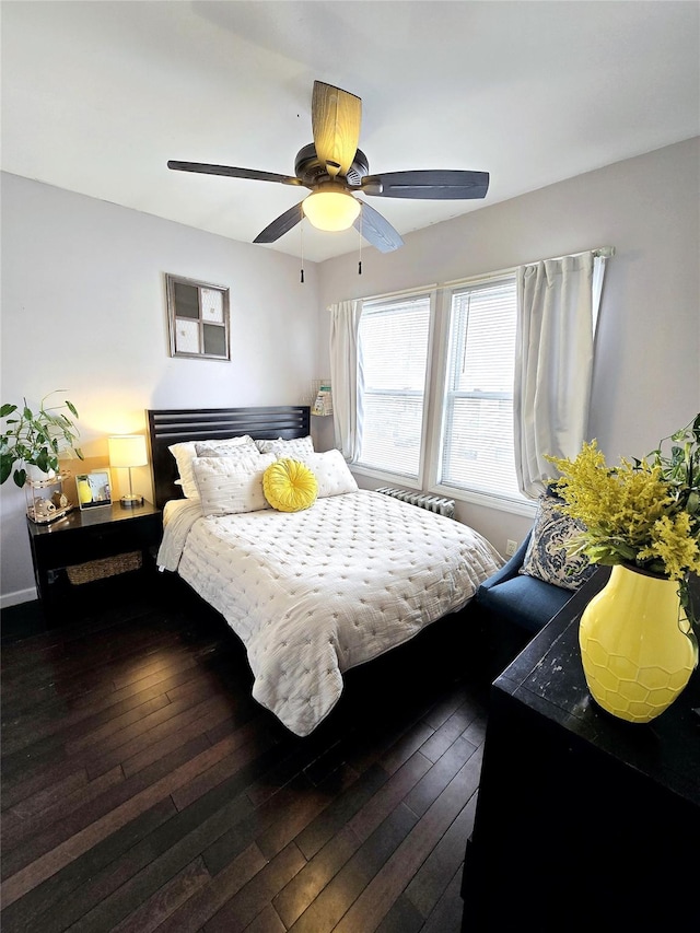 bedroom featuring dark hardwood / wood-style floors and ceiling fan