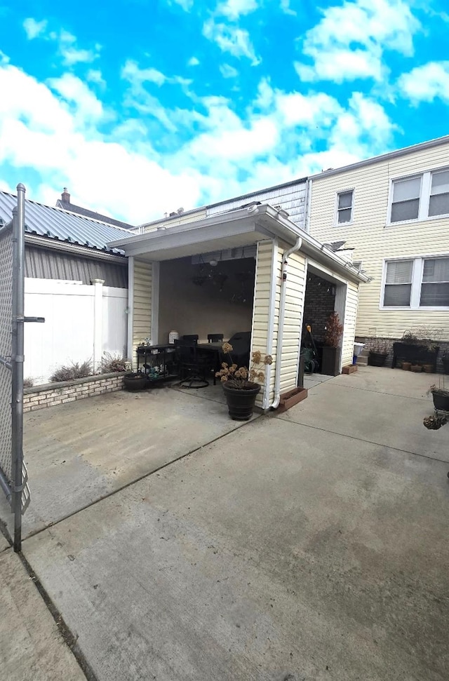 view of side of home with an outbuilding and a garage