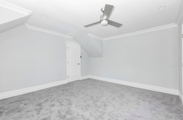 additional living space featuring vaulted ceiling, carpet floors, and ceiling fan