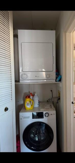 laundry area featuring stacked washer and clothes dryer