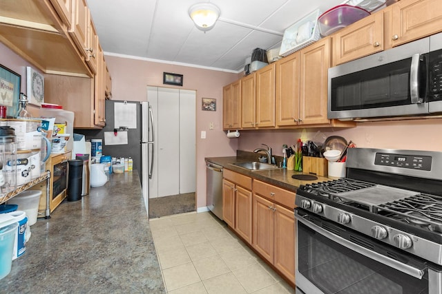 kitchen featuring stainless steel appliances, crown molding, sink, and light tile patterned floors