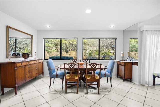 dining space with recessed lighting, light tile patterned flooring, and plenty of natural light