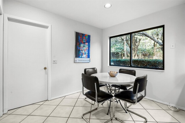 dining room featuring recessed lighting, baseboards, and light tile patterned floors