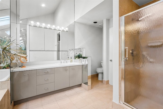 full bathroom with a bath, vanity, a shower stall, and toilet