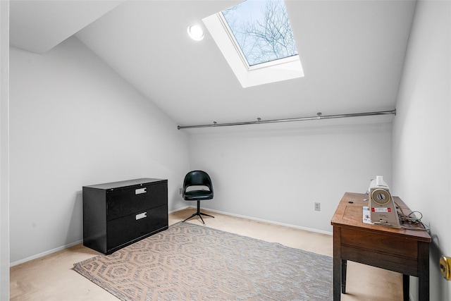 sitting room with vaulted ceiling with skylight, carpet, and baseboards