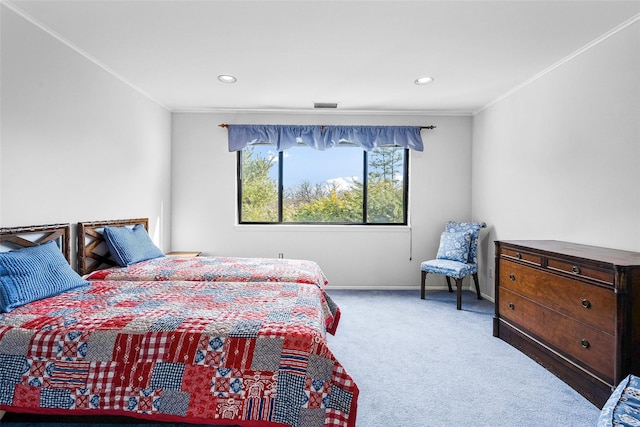 carpeted bedroom featuring ornamental molding, recessed lighting, visible vents, and baseboards