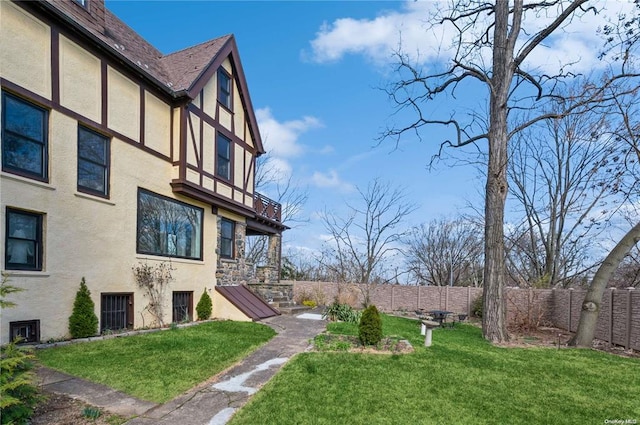 view of yard with a balcony