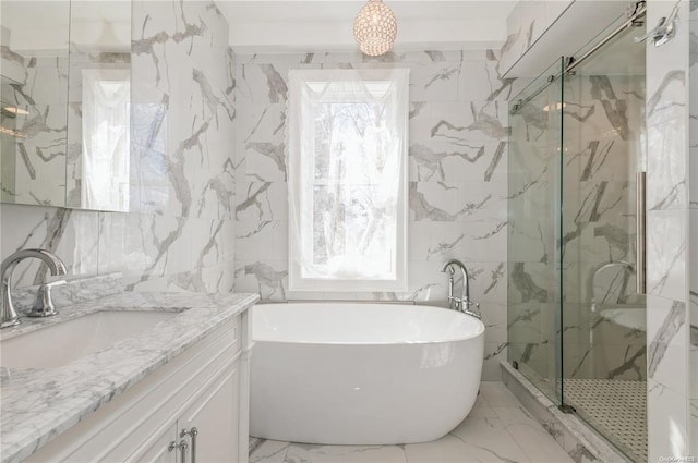 bathroom with vanity, tile walls, and separate shower and tub