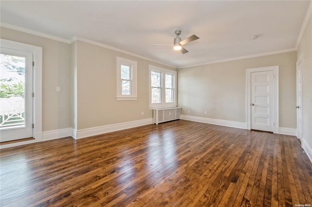 empty room with ornamental molding, radiator, ceiling fan, and dark hardwood / wood-style floors