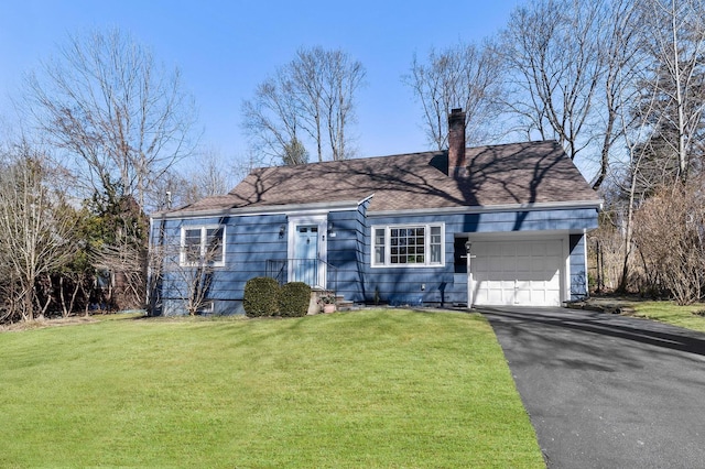 view of front of house with driveway, a front lawn, a chimney, and an attached garage