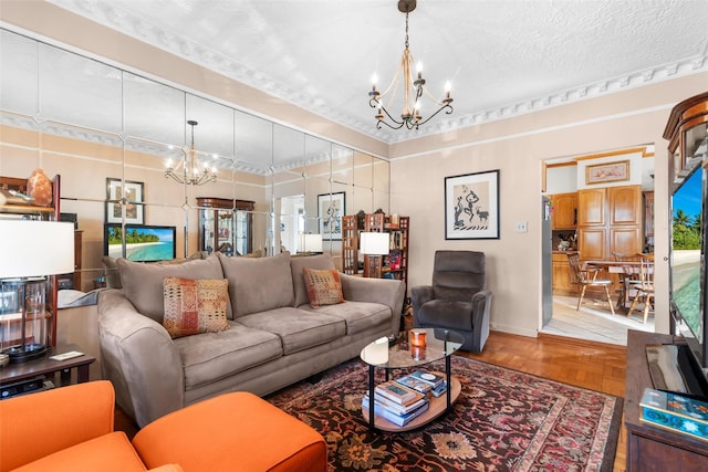 living room with parquet floors, a textured ceiling, and a notable chandelier