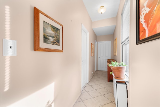 corridor with light tile patterned flooring