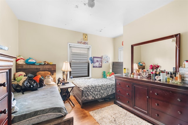 bedroom with light hardwood / wood-style flooring