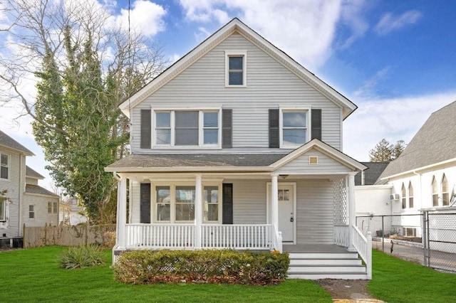 view of front of home featuring covered porch and a front yard