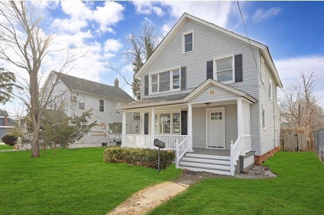 front of property featuring a porch and a front lawn