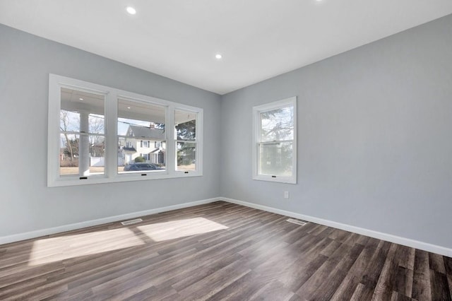 unfurnished room featuring dark wood-type flooring