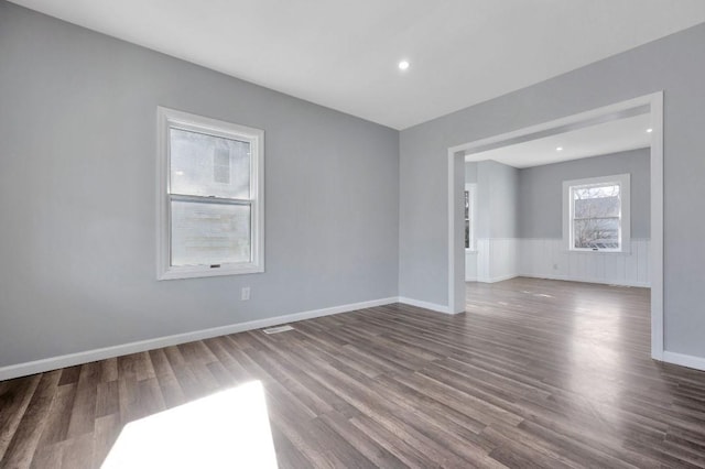 empty room featuring wood-type flooring