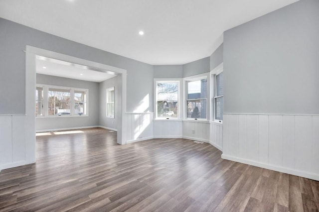 unfurnished room with hardwood / wood-style floors