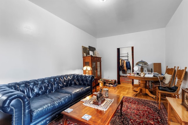 living room featuring parquet flooring