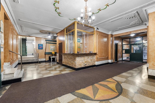 welcome area with ceiling fan with notable chandelier