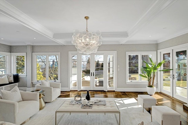 sunroom featuring a chandelier, french doors, beamed ceiling, and coffered ceiling