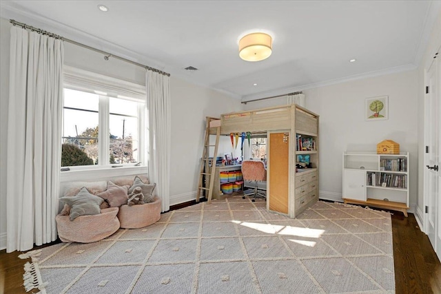 bedroom featuring baseboards, visible vents, ornamental molding, wood finished floors, and recessed lighting