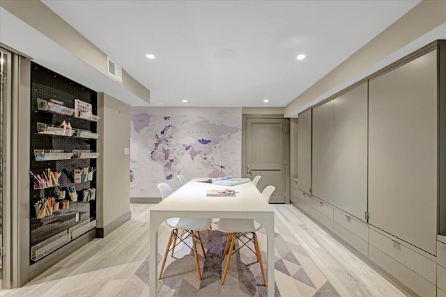 dining room with light wood-style floors, recessed lighting, visible vents, and wallpapered walls