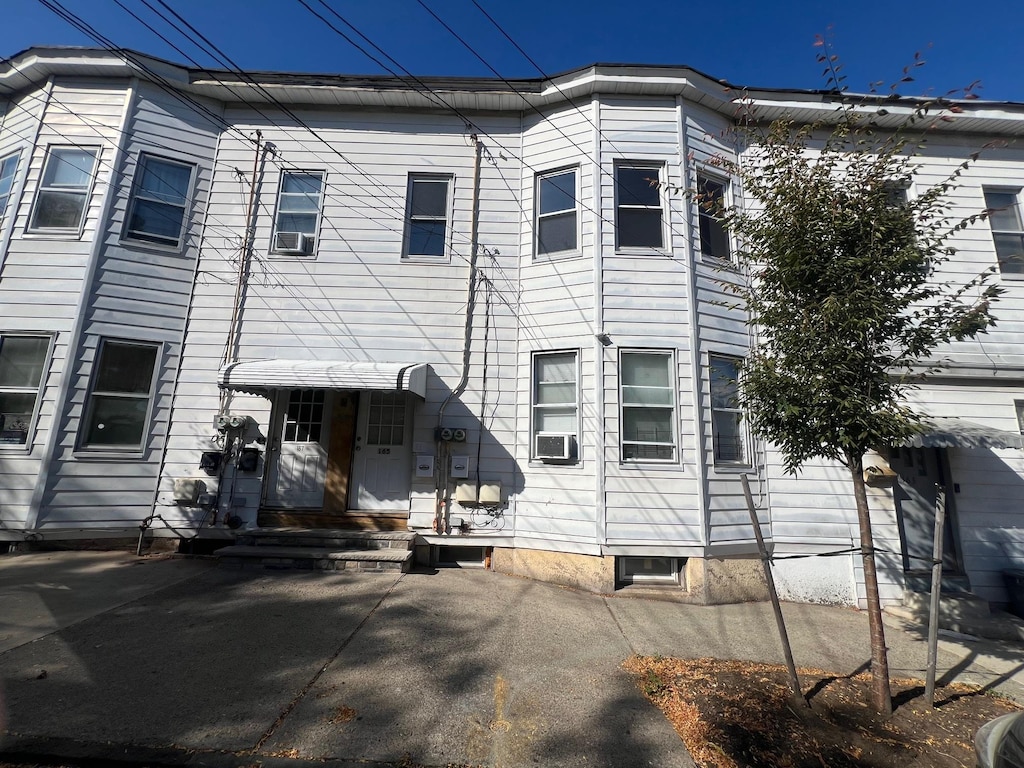 back of property with cooling unit