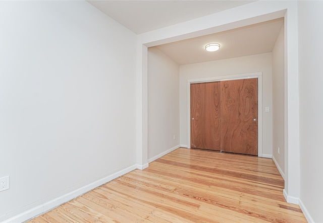 corridor featuring light hardwood / wood-style floors