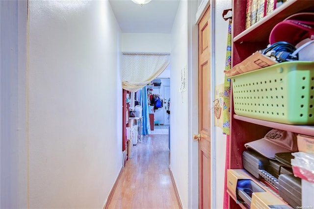 corridor featuring light hardwood / wood-style floors