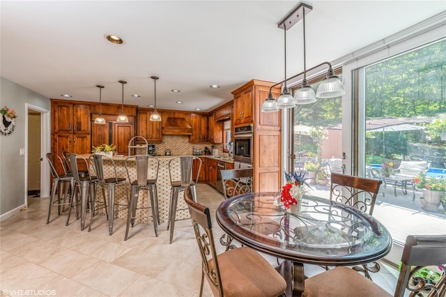 dining space with light tile patterned floors, baseboards, and recessed lighting