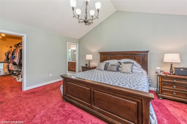 bedroom featuring lofted ceiling, a spacious closet, dark carpet, and baseboards