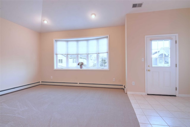 foyer entrance with light tile patterned flooring and lofted ceiling