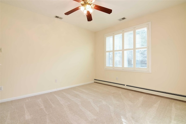 unfurnished room featuring ceiling fan, light carpet, and a baseboard heating unit