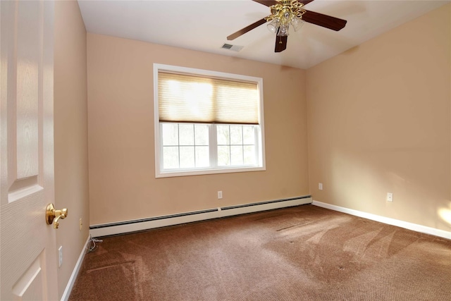 spare room with a baseboard heating unit, ceiling fan, and carpet