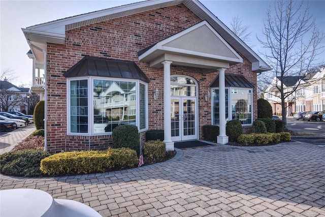 entrance to property featuring french doors