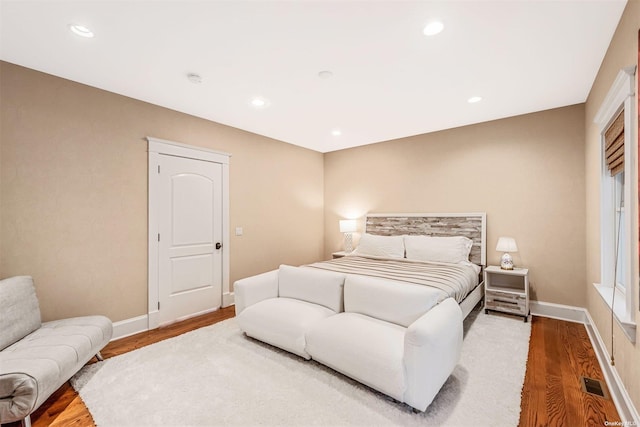 bedroom with hardwood / wood-style floors